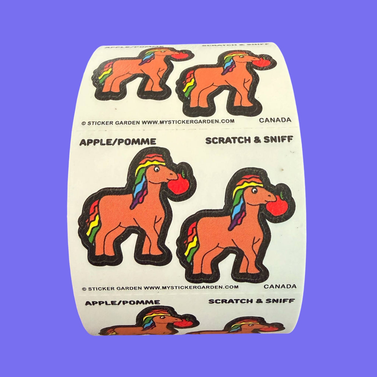 Scratch-and-sniff sticker roll with orange horse icons; apple scent graphic stickers