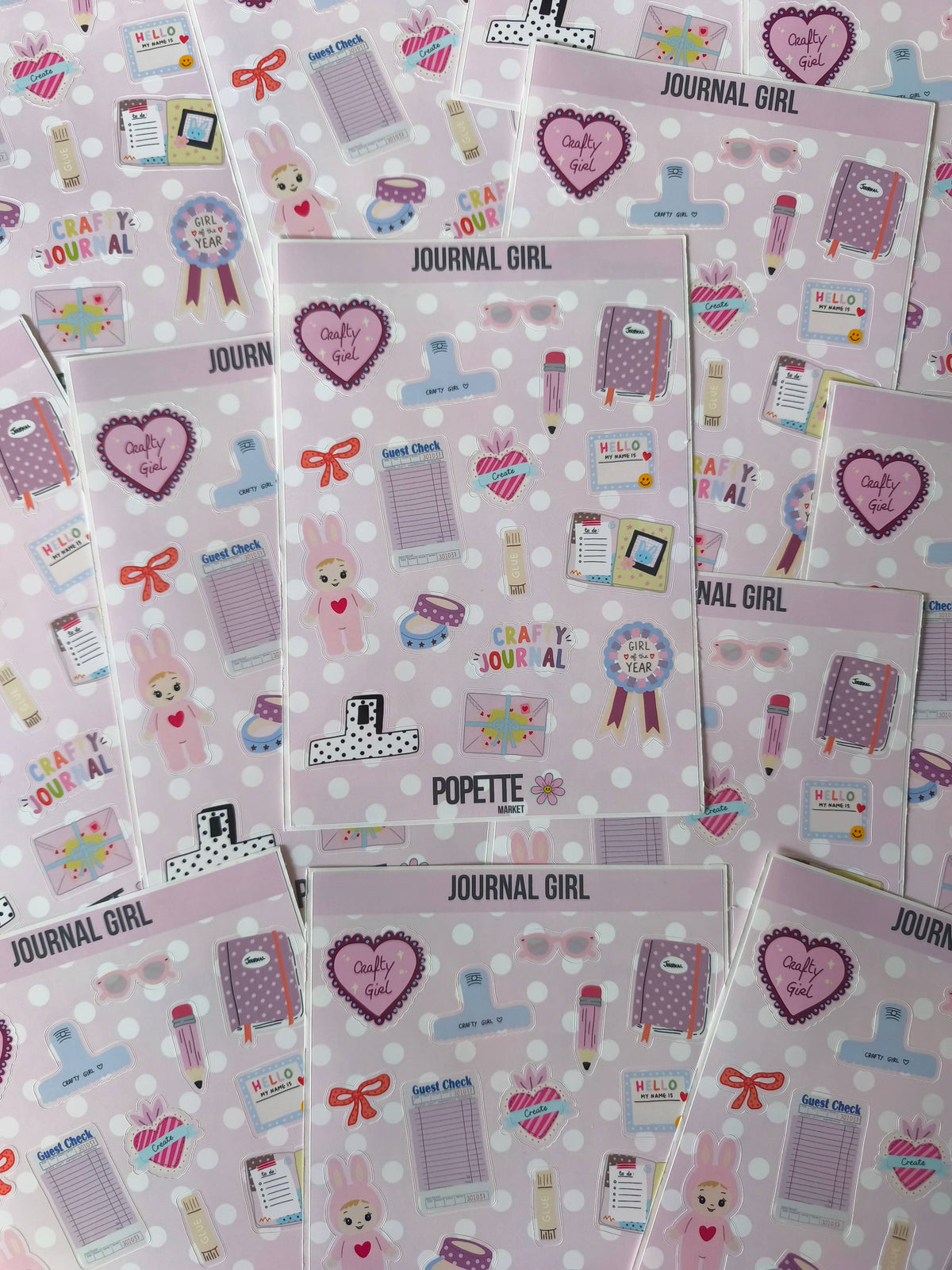 Multiple A5 journal-themed sticker sheets with hearts, notebooks, pens, and gift bows pattern