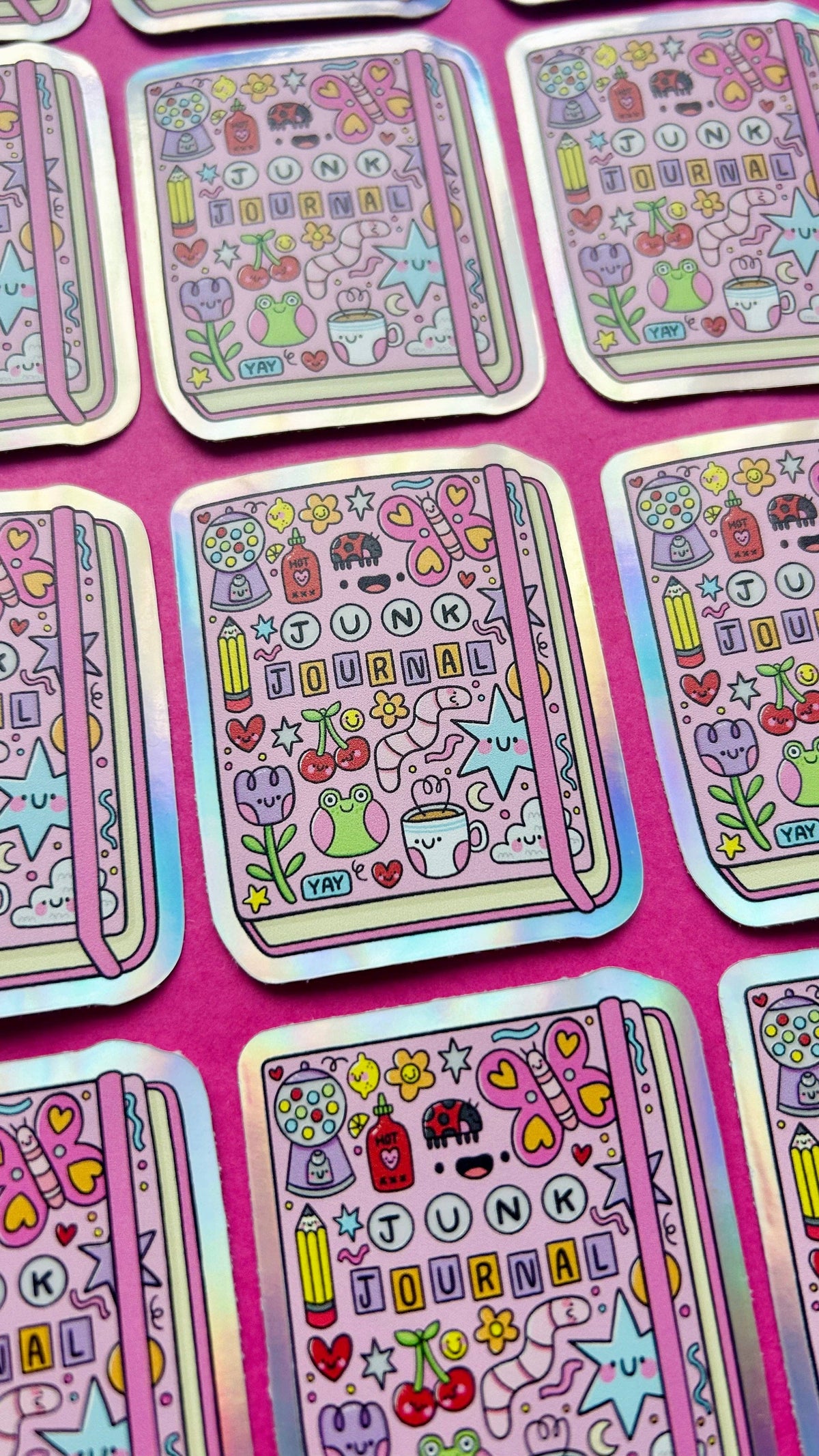 Holographic vinyl sticker sheet with multiple junk journal doodle designs and heart icons