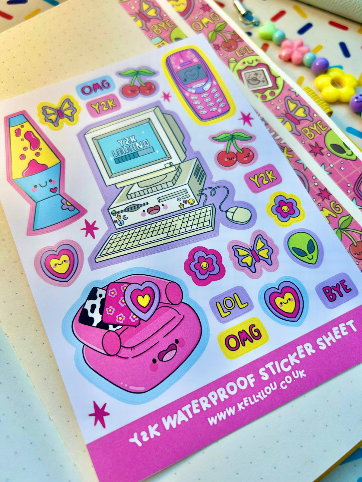 Vinyl sticker sheet featuring computer, phone, flowers, hearts, cherries, alien, LOL/OMG
