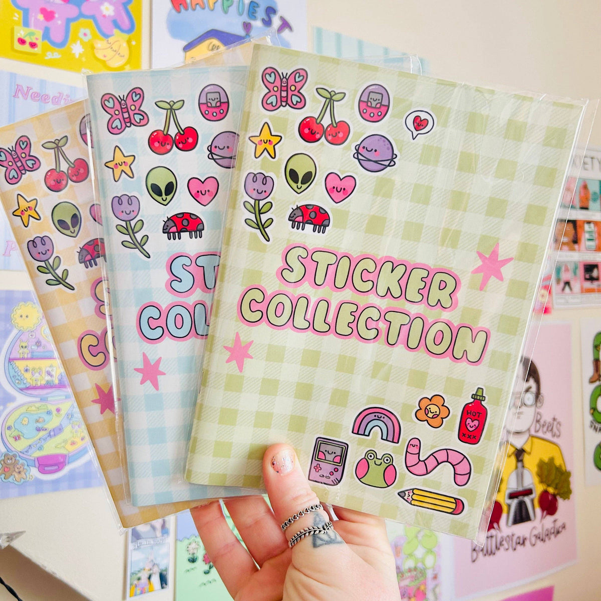 Green checkered reusable sticker book cover with colorful doodle stickers and title