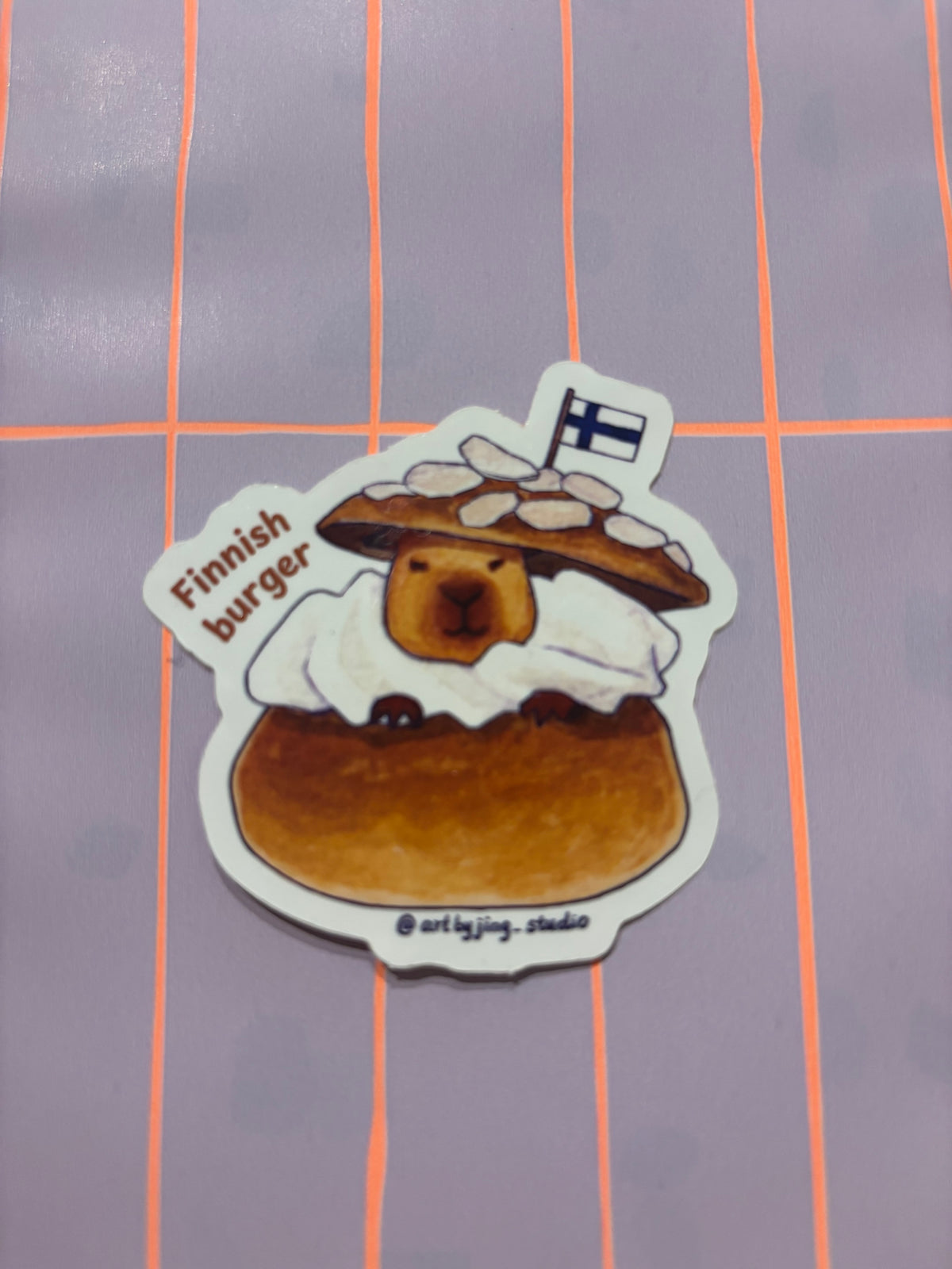 Finnish burger vinyl sticker of a burger with fried patty, text on left side