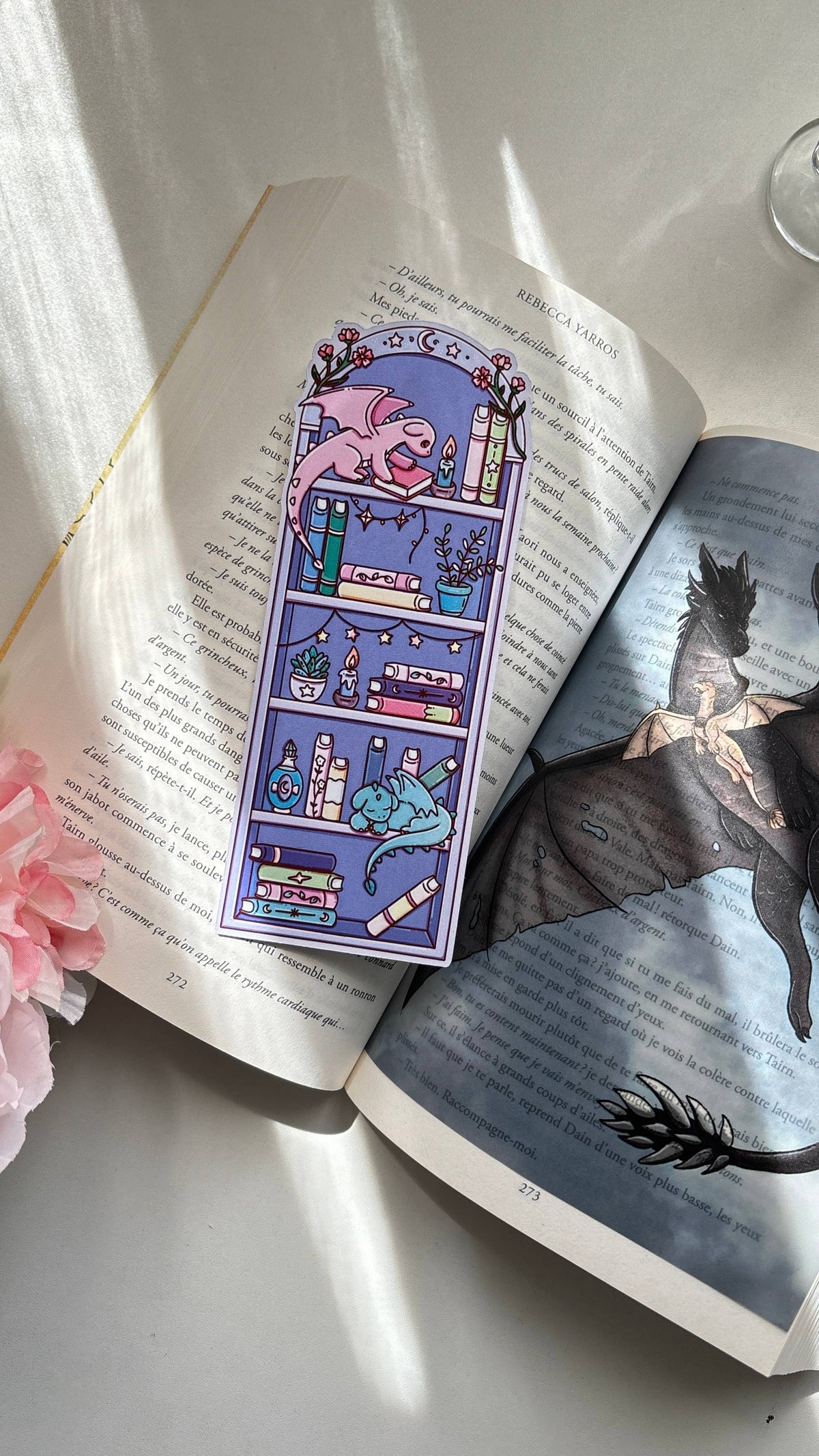 Fantasy bookmark with whimsical shelves and small icons in purple and blue