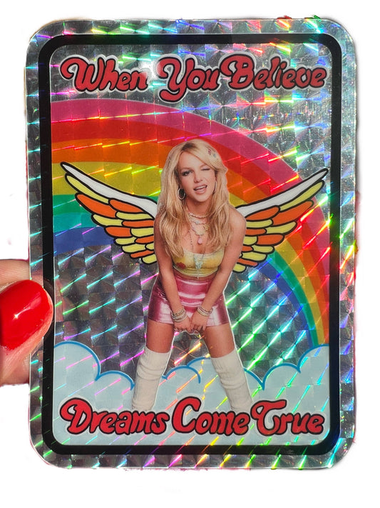 4-inch holographic affirmation sticker with wings and “When You Believe / Dreams Come True”.
