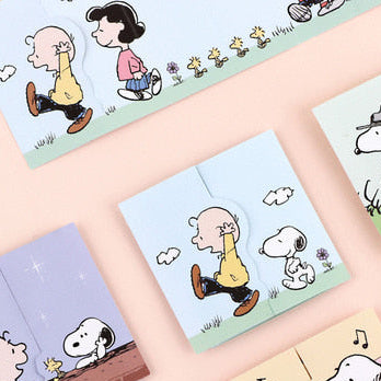Peanuts Friends expanding mini card with Snoopy and Charlie Brown cartoon panels