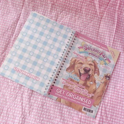 Reusable sticker book, angled view, spiral binding and golden retriever cover.