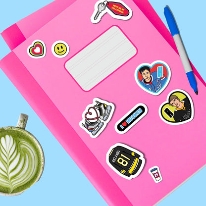 A5 sticker sheet with assorted hockey stickers on pink paper, including hearts, jerseys, and smiley