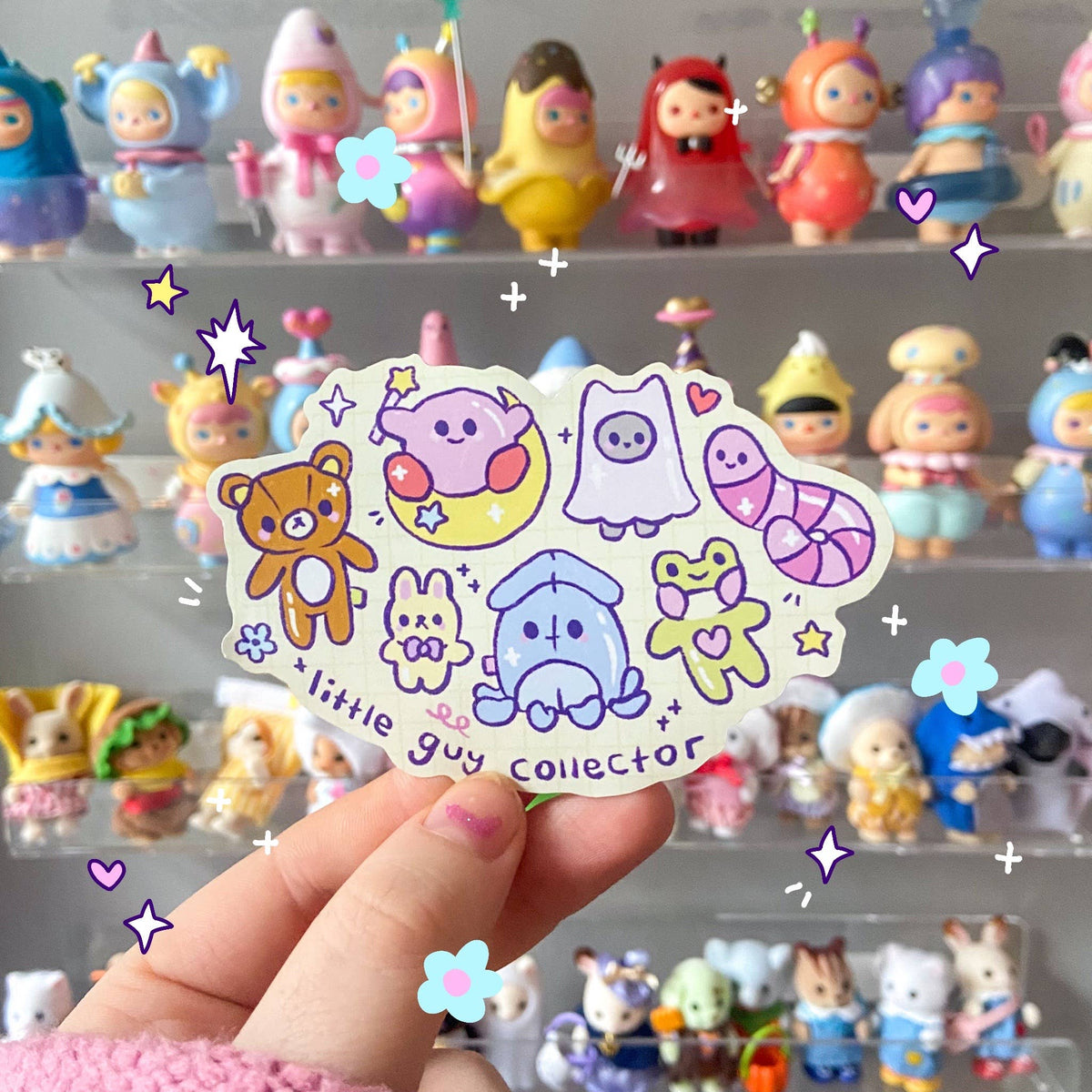 Handheld animal trinket sticker sheet with stars and little guy collector text
