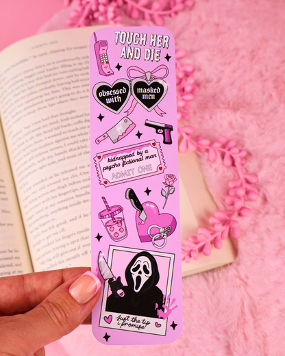 Purple illustrated bookmark with skull figure at the bottom and gothic icons