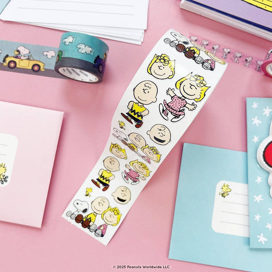 Sticker roll with die-cut Peanuts characters, including Charlie Brown and Sally, on a long strip