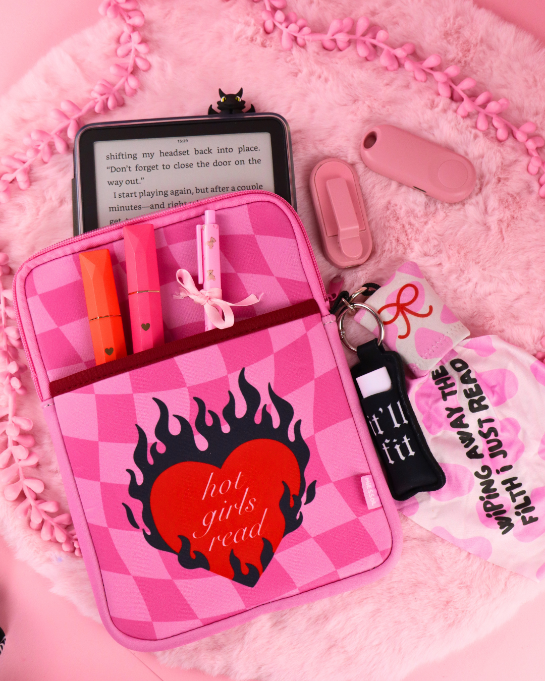 Pink checkered e-reader sleeve, open with tablet and elastic pen holder