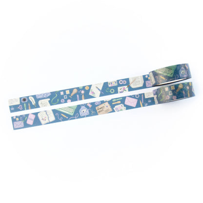 Blue washi tape strip laid out horizontally with repeating envelopes, books, and tools.