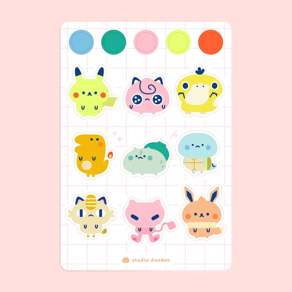 Vinyl sticker sheet with colorful cute animal character stickers on grid backing