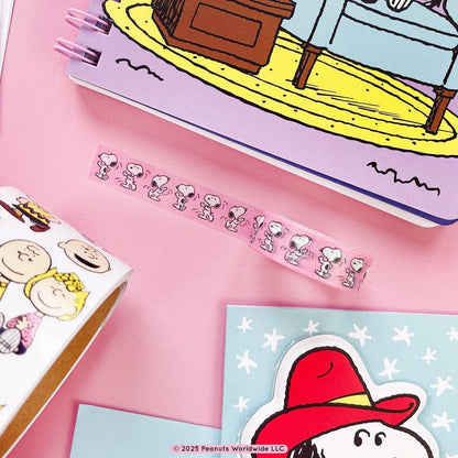 Snoopy character wash tape strip on pink surface with small line illustrations