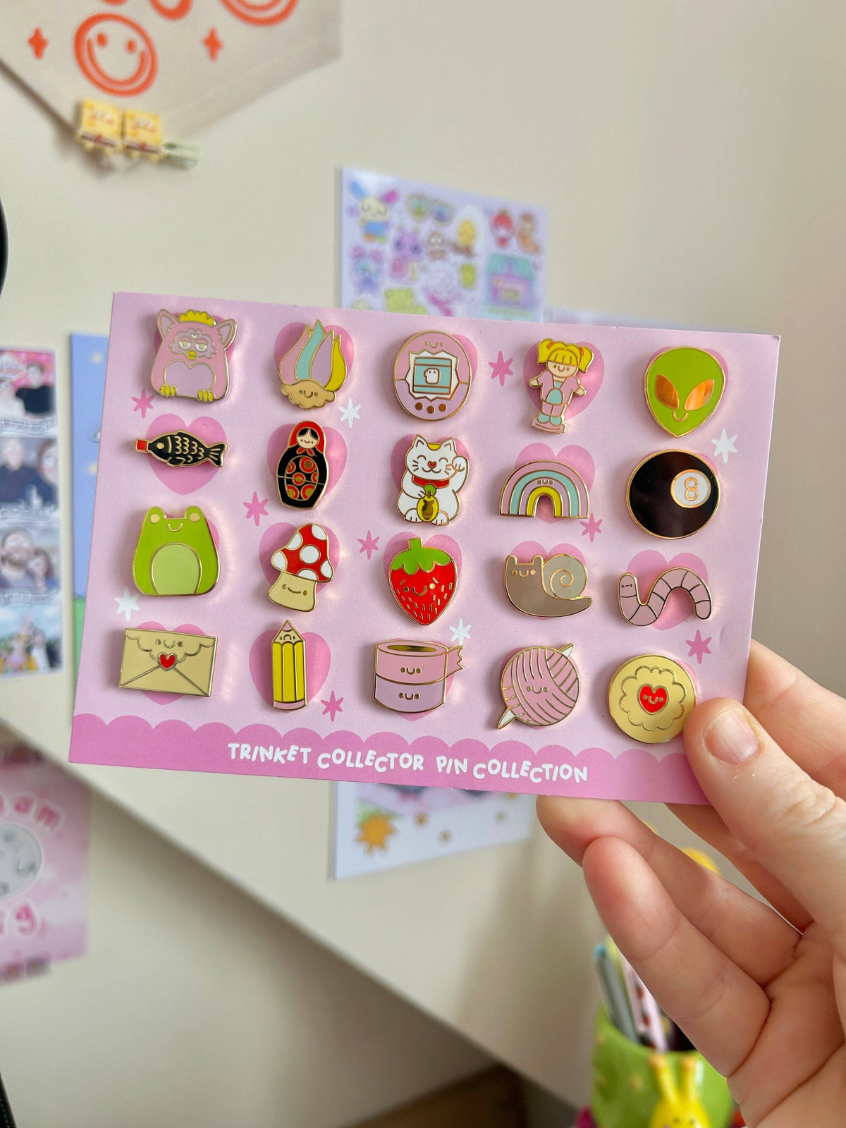 Trinket collector pin card with multiple colorful enamel pins arranged in a grid.