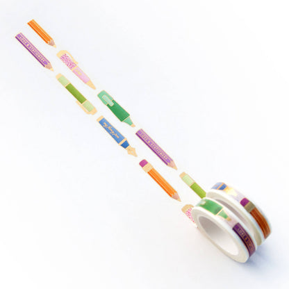 Washi tape roll with several pen-shaped strip designs in green, blue, pink, and orange