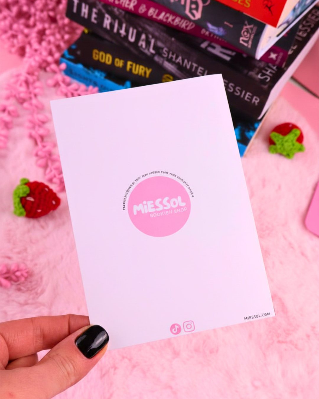 Blank greeting card with circular MiESSEL logo and small social icons.