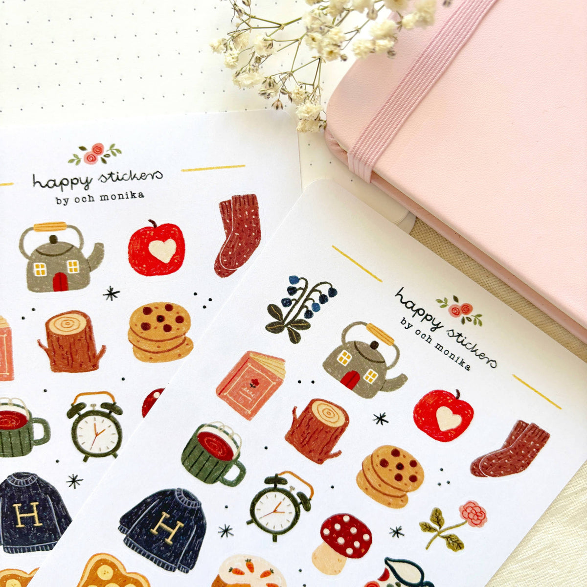 Sticker sheet close-up with illustrated teapot, heart, stocking, cookies, and mushrooms