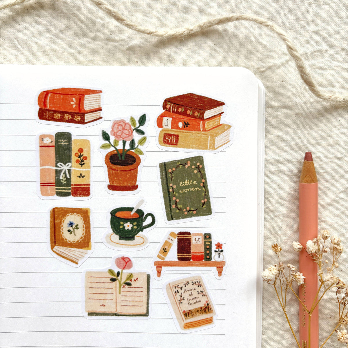 Bookish sticker sheet with book stacks, teacup, potted flowers, and bookmarks