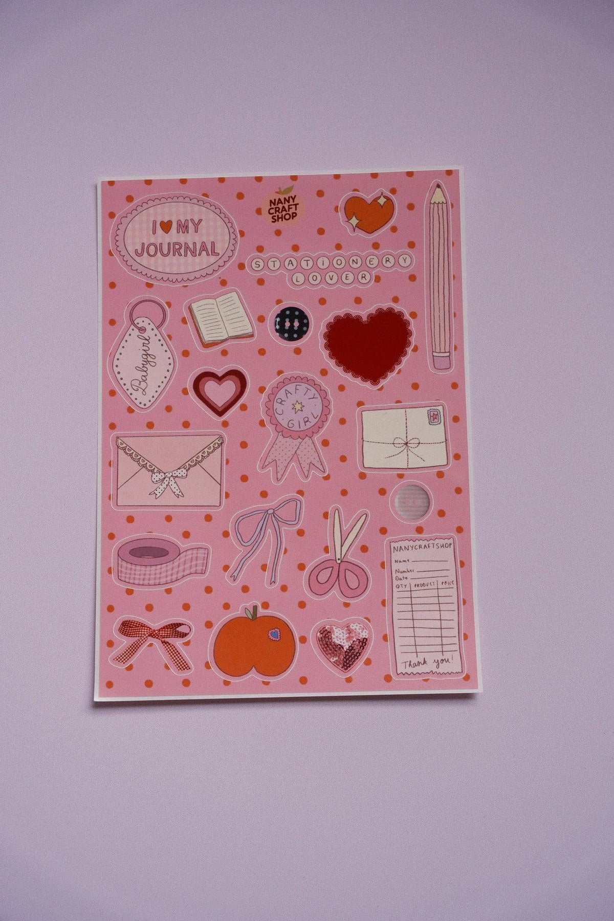 Pink sticker sheet with hearts, envelopes, clocks, and doodle icons