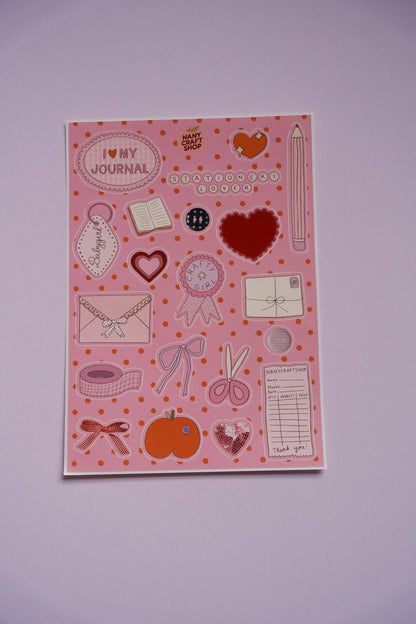 Pink sticker sheet with hearts, envelopes, clocks, and doodle icons