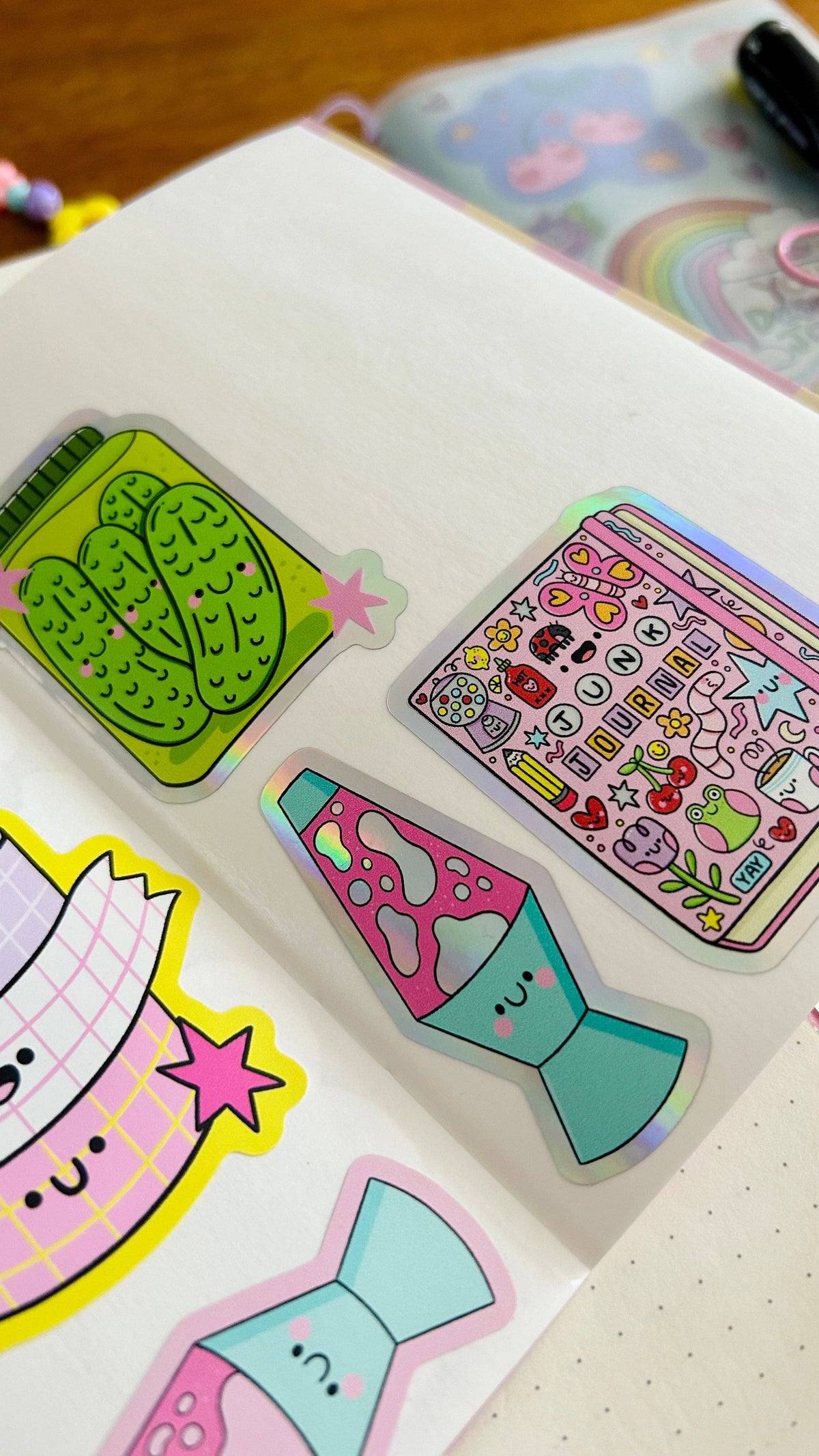 Reusable sticker book page with assorted cute sticker shapes and icons