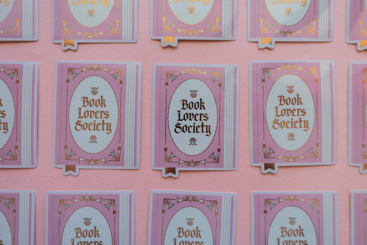 Vinyl sticker set on cards, each with purple oval “Book Lovers Society” design