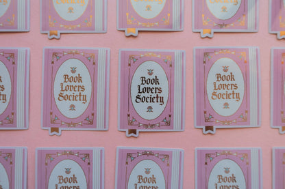 Vinyl sticker set on cards, each with purple oval “Book Lovers Society” design