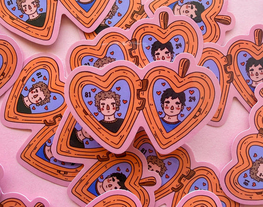 Heated Rivalry vinyl sticker hearts with cartoon faces and blue icons, orange outline
