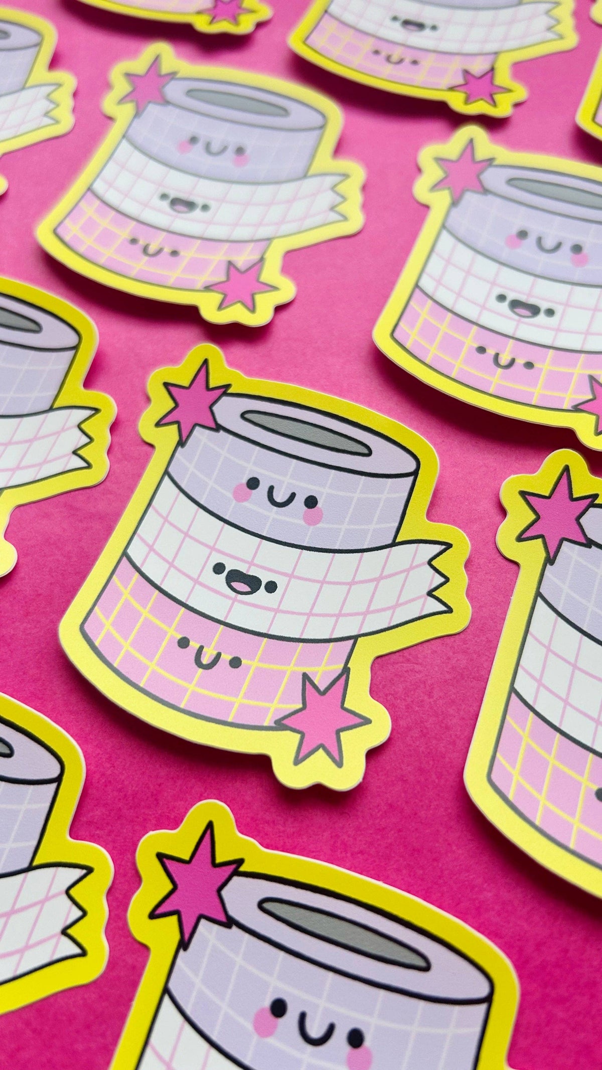 Set of cartoon vinyl stickers: stacked smiling cups with grid pattern and yellow stars