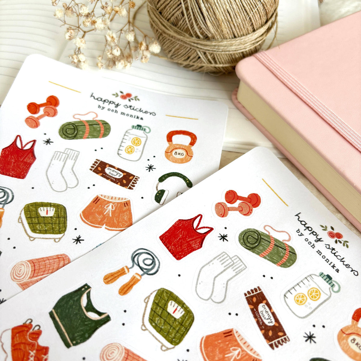 Close-up fitness sticker sheet with dumbbells, sports clothing, water bottle, and gym items