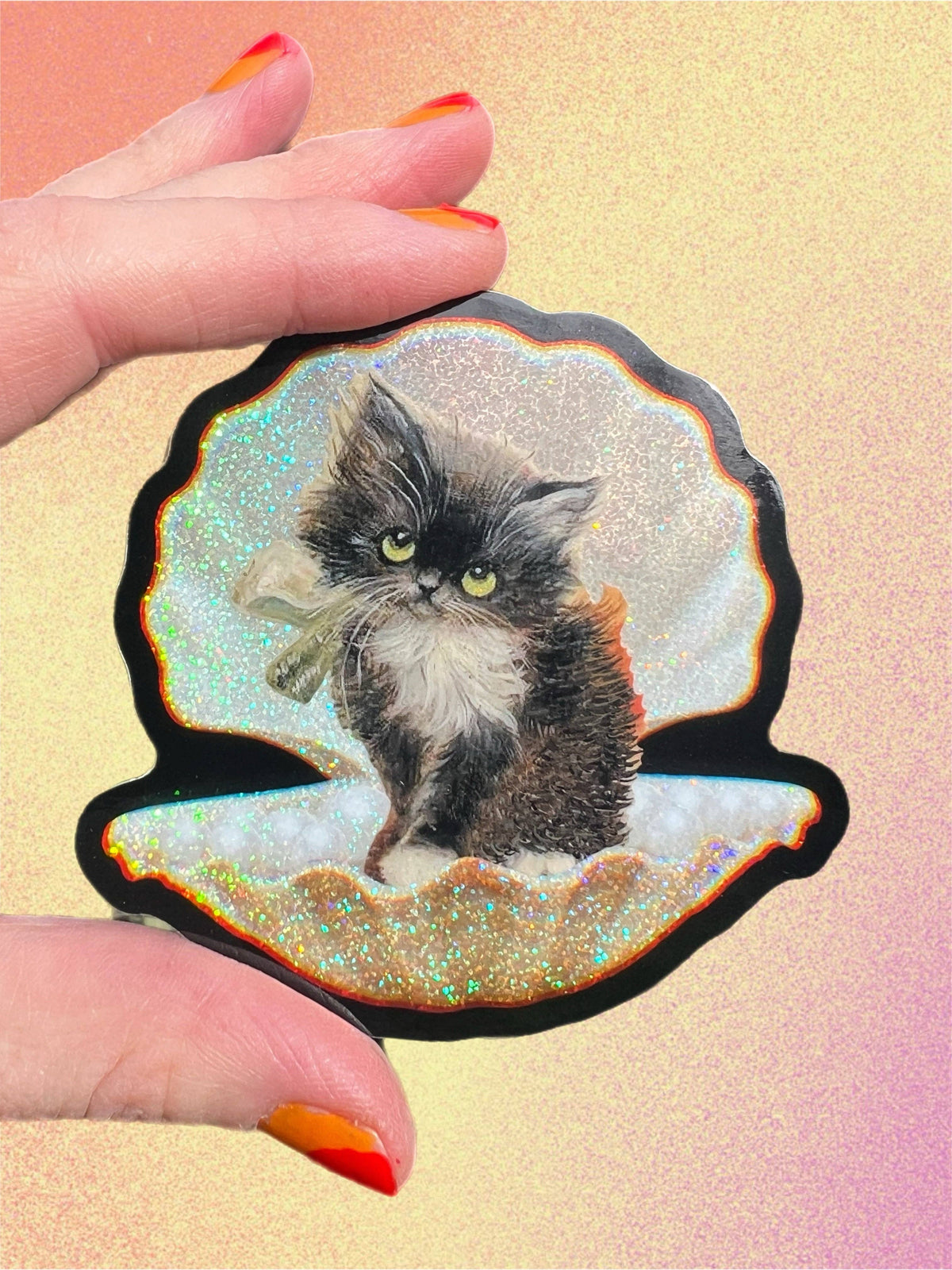 3-inch tuxedo cat in seashell sticker with glittery iridescent edges