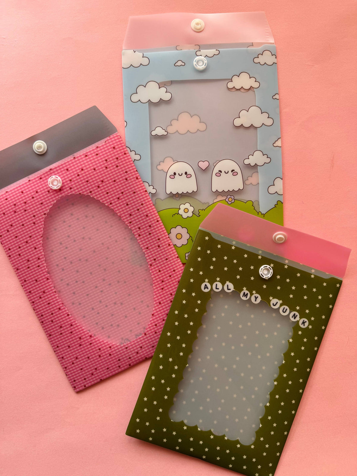 Gingham envelope sleeves with snap buttons in pink, blue, and green patterns