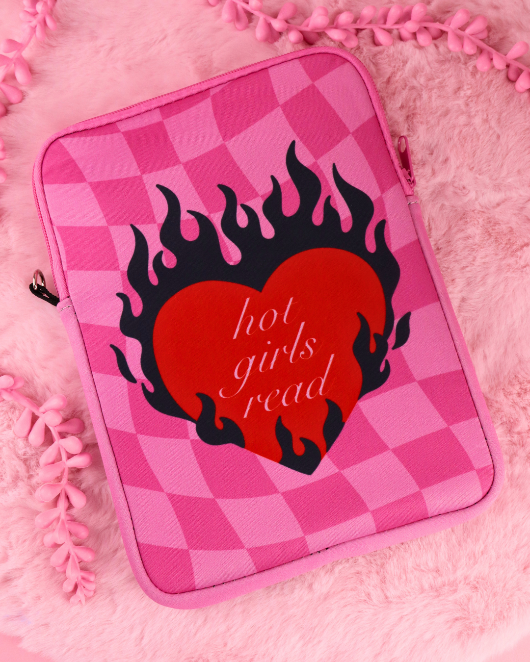 Pink checkered e-reader sleeve with zip and black flame-heart graphic