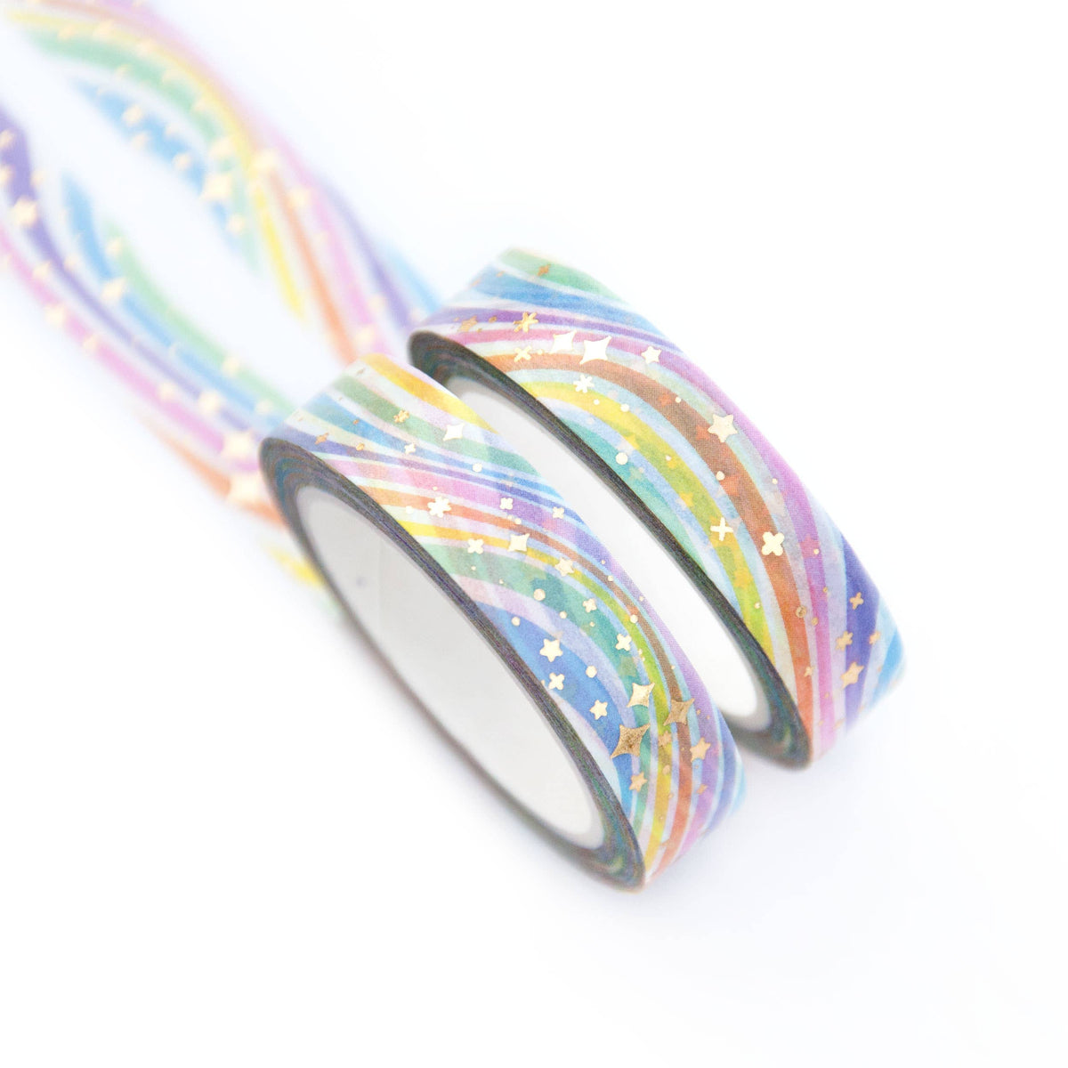 Washi tape rolls with pastel rainbow stripes and small star confetti, two rolls