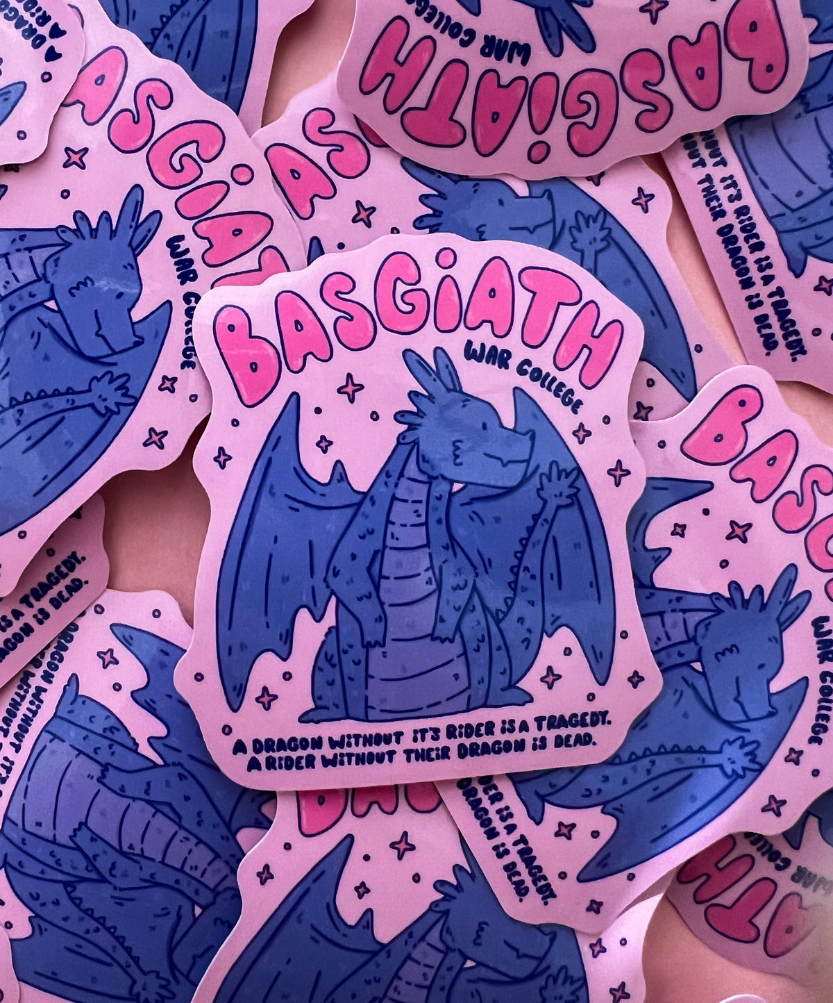 Vinyl sticker with pink lettering 'Basgiath' and blue dragon graphic