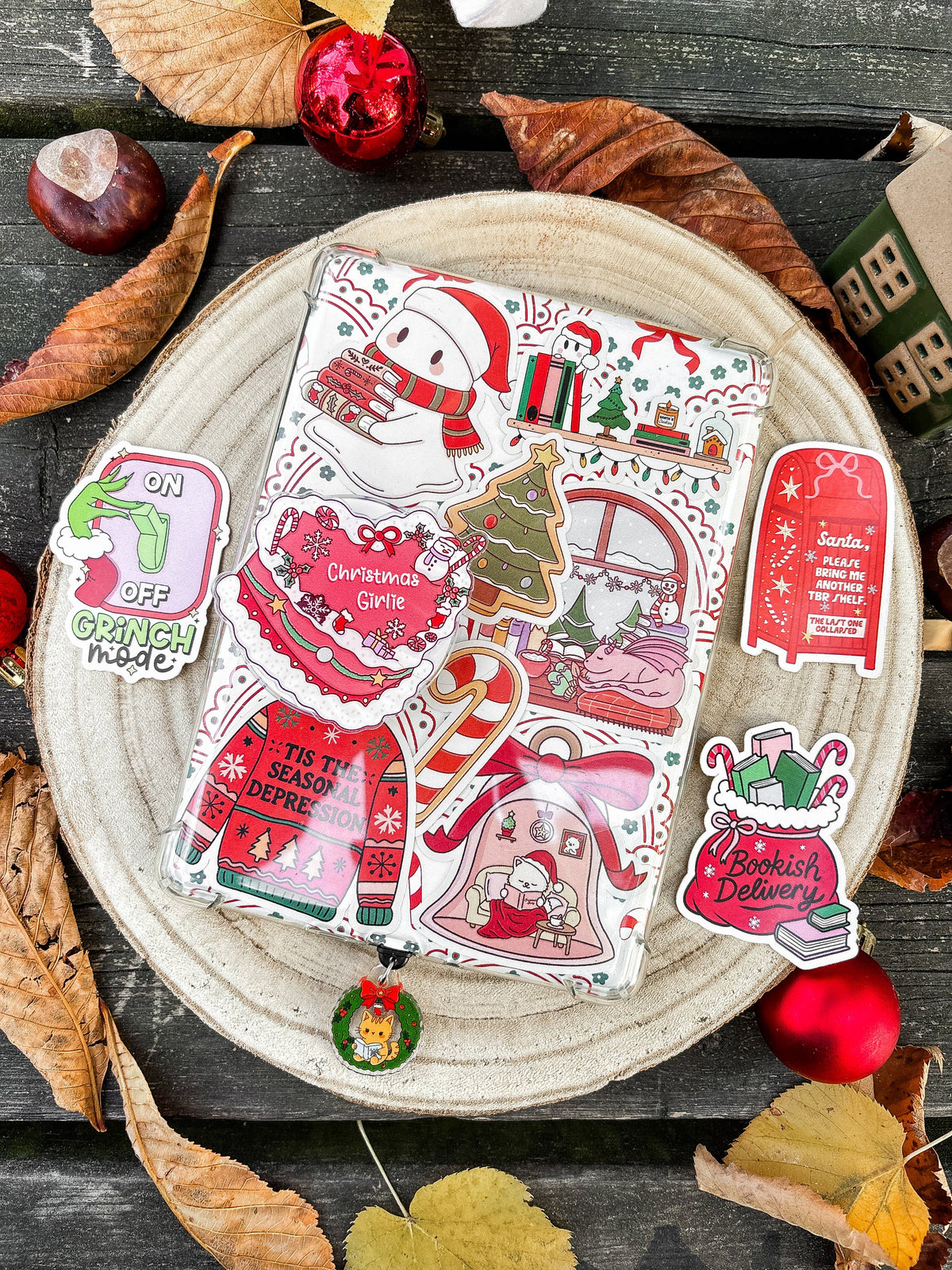 Christmas book-themed vinyl sticker sheet with characters and holiday building designs