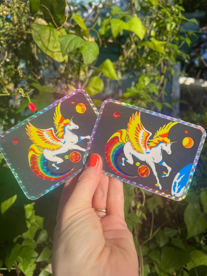 Two holographic pegasus glitter stickers showing winged unicorns with rainbow arcs