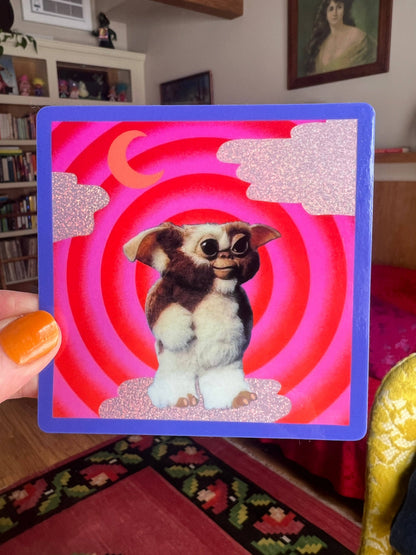 Square Mogwai sticker, blue frame, glitter art of brown-and-white cartoon dog in red