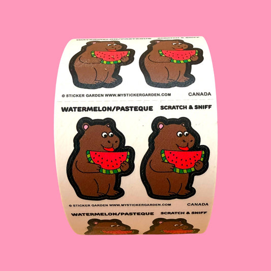 Scratch-and-sniff sticker roll with four capybara stickers holding watermelon slices