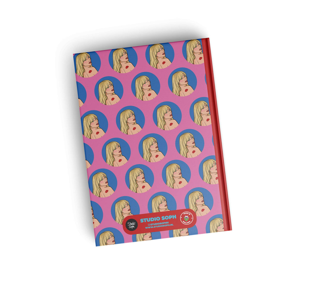 A5 notebook cover with purple repeating face pattern, “STUDIO SOPHIE” badge at bottom.