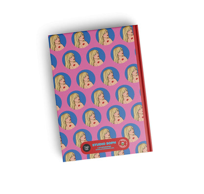 A5 notebook cover with purple repeating face pattern, “STUDIO SOPHIE” badge at bottom.