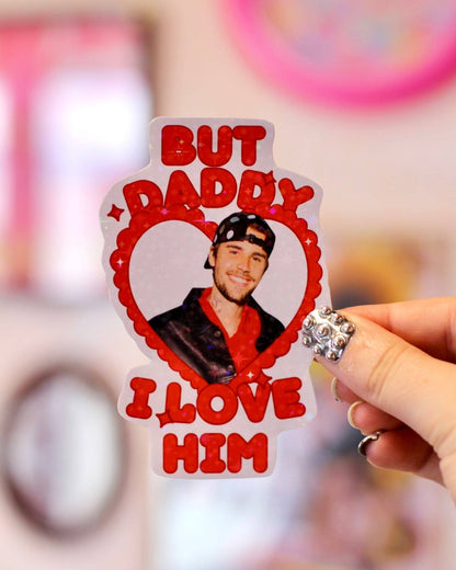 Heart sticker with Justin Bieber portrait and red lettering “But Daddy I love him”