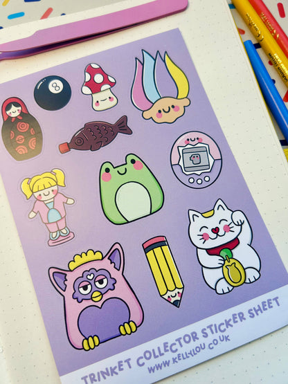 Vinyl sticker sheet featuring penguin, cat, girl, frog, pencil, gaming device icons.