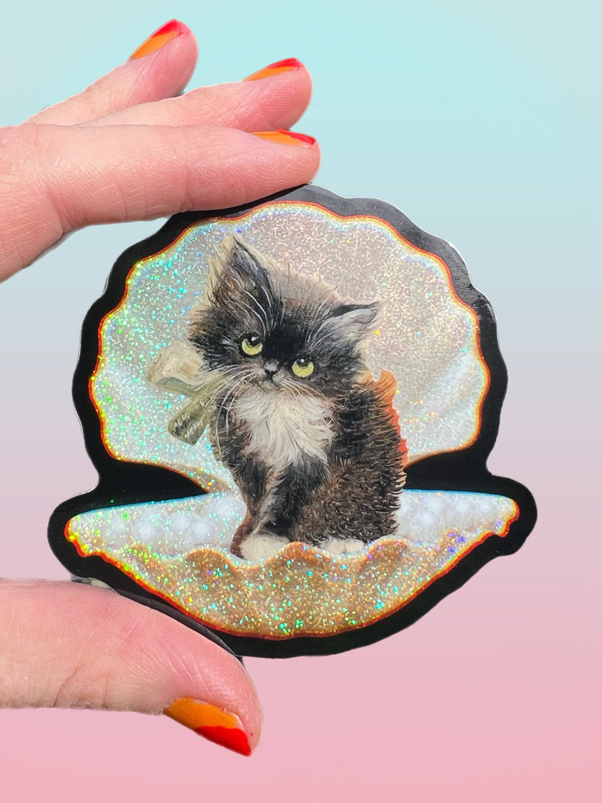 3-inch tuxedo cat in seashell sticker with glittery iridescent edges