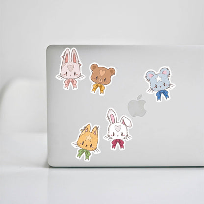 Bunny animal stickers on laptop: rabbit, bear, cat and mouse with bow accents