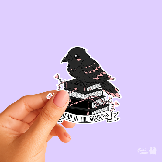 Raven reading sticker with stacked books and dark word art, die-cut outline