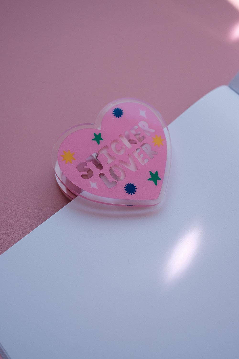 Heart-shaped notebook clip with pink “Sticker Lover” text and star icons