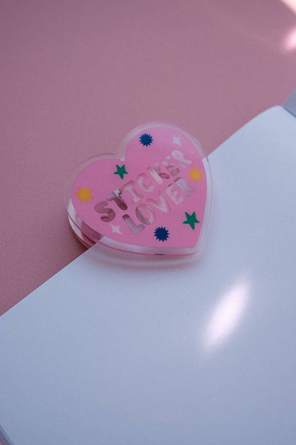 Heart-shaped notebook clip with pink “Sticker Lover” text and star icons