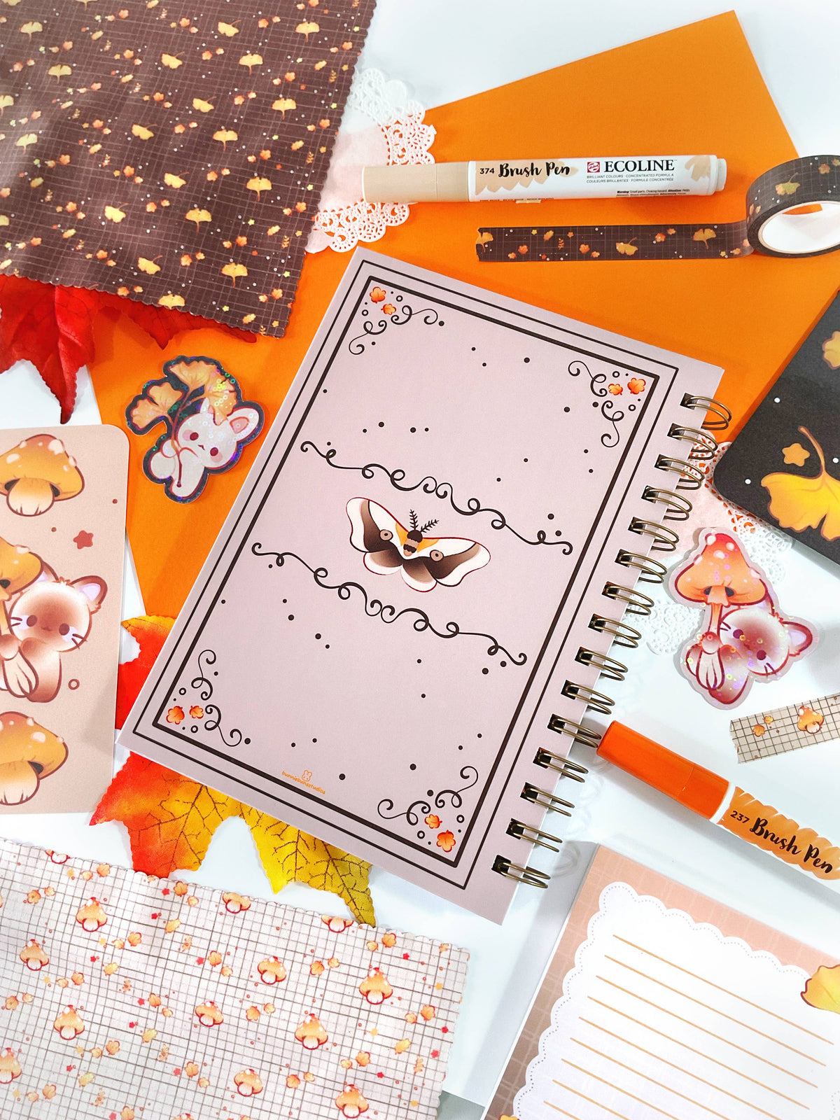 Open spiral notebook with animal illustration cover and lined notes pages